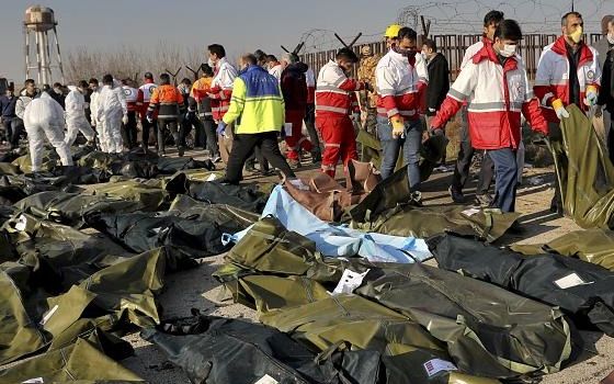 Body bags on the ground after the downing of a Ukrainian airliner on January 8, 2020