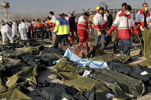 Body bags on the ground after the downing of a Ukrainian airliner on January 8, 2020