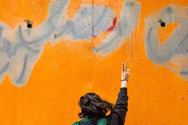Walls Falling Under Weight Of Anti-Regime Graffiti In Iran