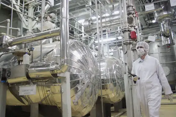 A worker walks inside of an uranium conversion facility outside the city of Isfahan.