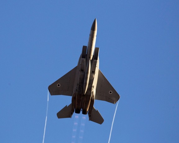 An Israeli air force F-15 fighter jet flies during an exhibition as part of a pilot graduation ceremony at the Hatzerim air base in southern Israel June 26, 2014.