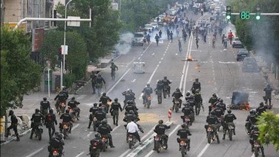 Riot police against protesters in Tehran during 2019 protests