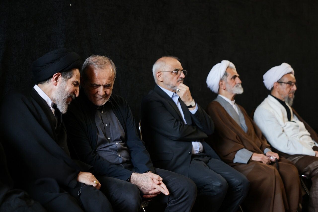 Iranian President Masoud Pezeshkian listens to Tehran Friday prayer leader Mohammad-Hassan Aboutorabi Fard during a memorial ceremony for prominent jurist Mousa Shabiri Zanjani in Tehran, Iran, September 30, 2026