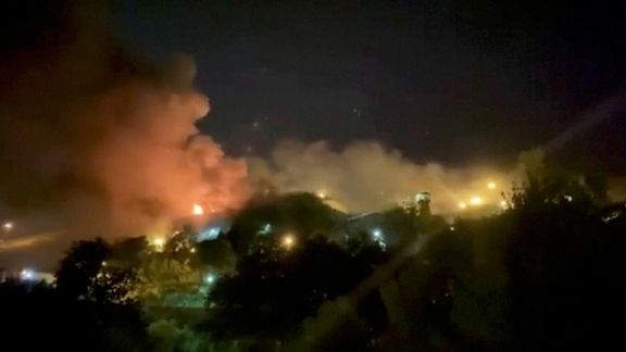 A view of smoke rising from Evin Prison in Tehran, Iran, October 15, 2022 in this still image take from a video