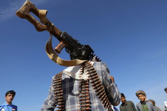 A tribesman loyal to the Houthis carries a machine gun during a military parade for new tribal recruits amid escalating tensions with the US-led coalition in the Red Sea, in Bani Hushaish, Yemen January 22, 2024.