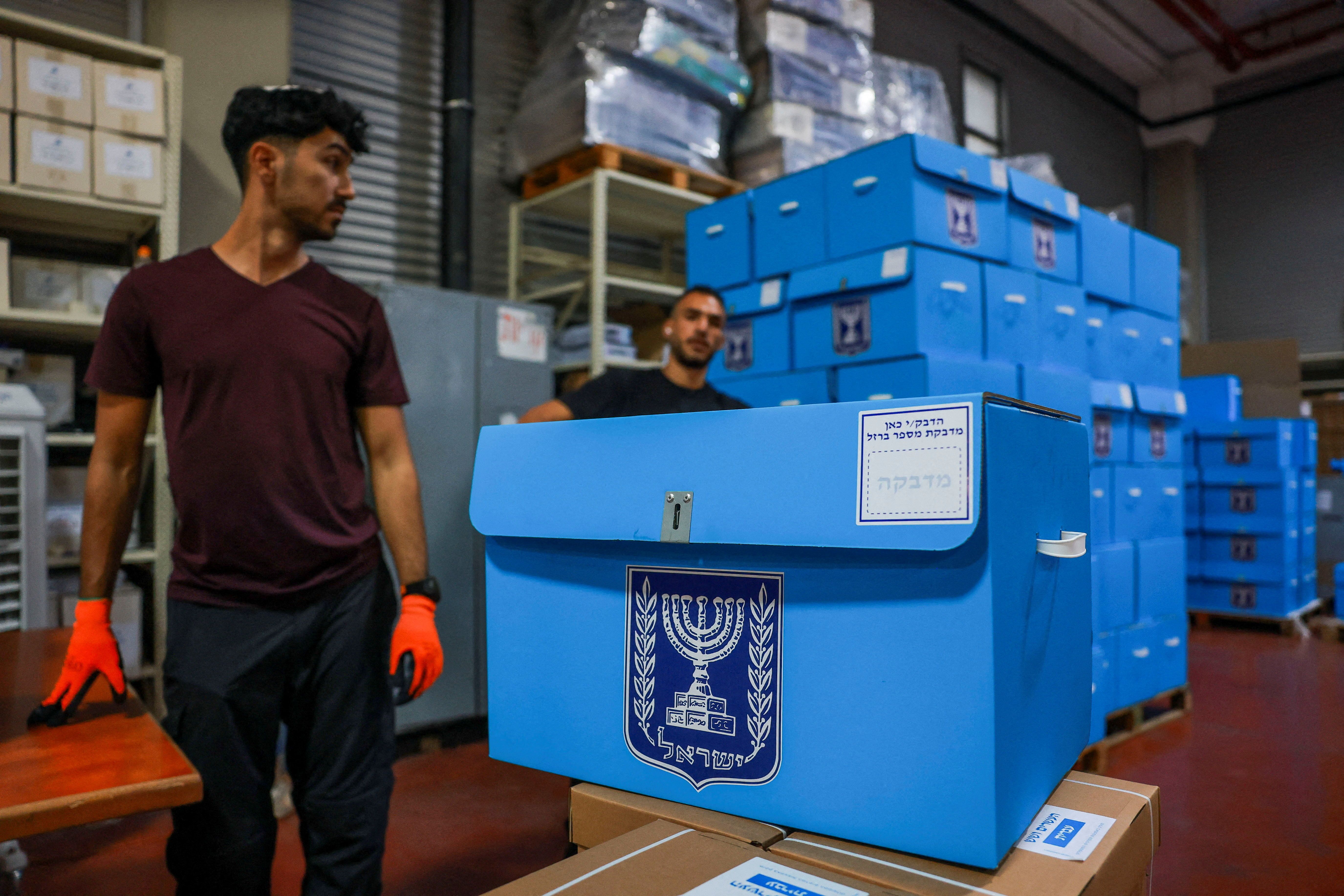 Workers prepare ballot boxes for distribution, at the Israeli Central Elections Commission warehouse, ahead of Israel's national election, in Shoham, Israel, October 14, 2026.