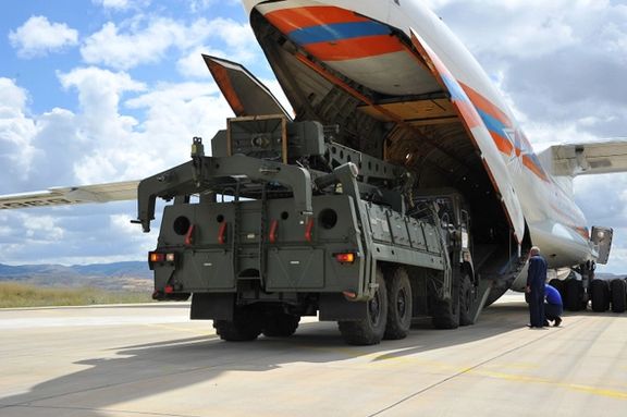 First parts of a Russian S-400 missile defense system are unloaded from a Russian plane at Murted Airport, known as Akinci Air Base, near Ankara, Turkey, July 12, 2019.