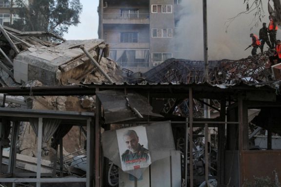 A picture of late senior Iranian military commander General Qassem Soleimani hangs amid rubble after what Syrian and Iranian media described as an Israeli air strike on Iran's consulate in the Syrian capital Damascus April 1, 2024.