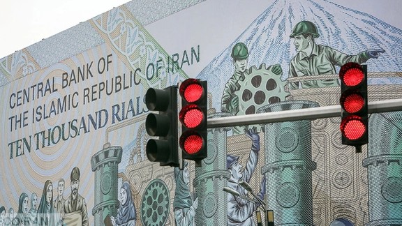 File photo of a mural at Tehran’s Enqelab square showing the Iranian 10,000-rial banknote worth less than two cents now