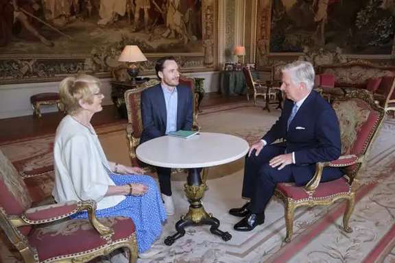King Philippe - Filip of Belgium (R), Olivier Vandecasteele (C) and Olivier's mother Annie Santy pictured at a meeting at the Royal Castle in Laken, Brussel, May 30, 2023