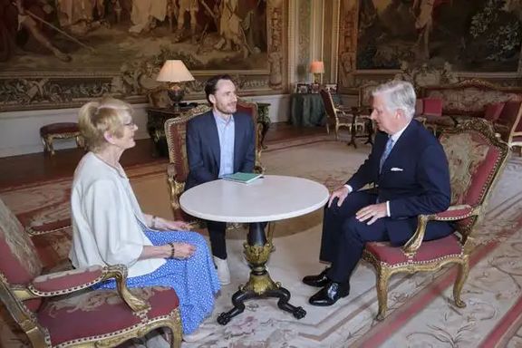 King Philippe - Filip of Belgium (R), Olivier Vandecasteele (C) and Olivier's mother Annie Santy pictured at a meeting at the Royal Castle in Laken, Brussel, May 30, 2023