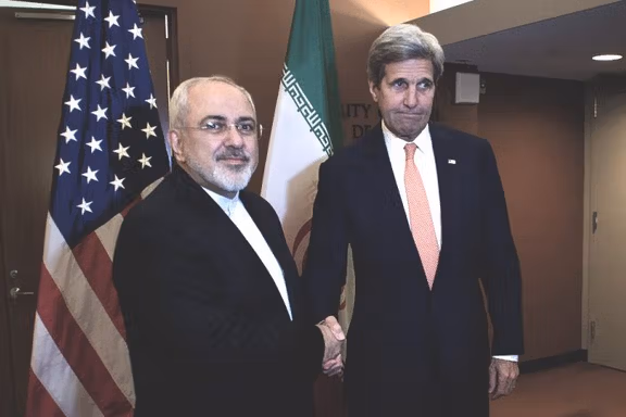 Kerry shakes hands with former Iranian Foreign Minister - File photo