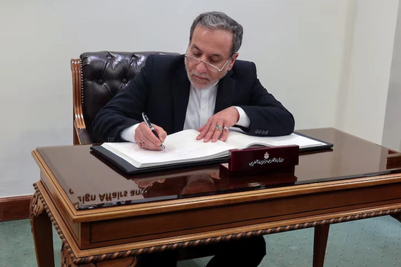 Iran's Foreign Minister Abbas Araqchi signs a guest book at the Jordanian Foreign Ministry in Amman, Jordan October 16, 2024.