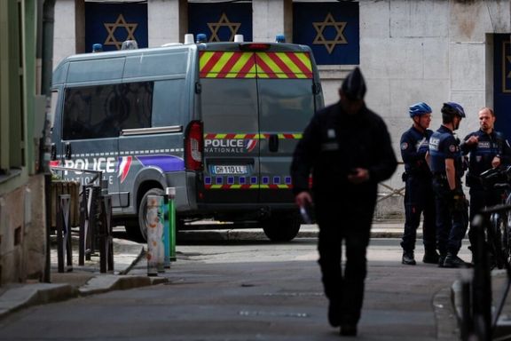 Police officers work after police shot dead an armed man earlier who set fire to the city's synagogue in Rouen, France, May 17, 2024.