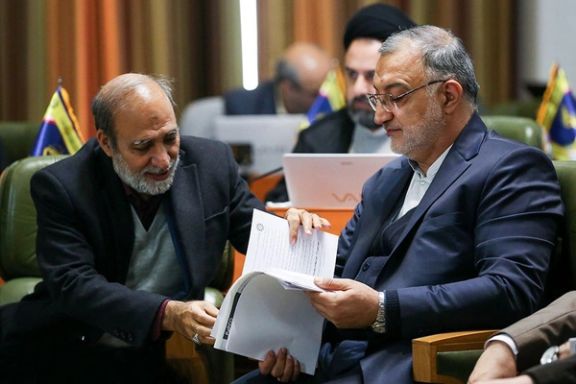 Tehran Mayor Alireza Zakani (R) and his financial deputy Lotfollah Forouzandeh