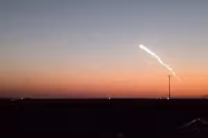 Rare missile tests streak through Tehran twilight