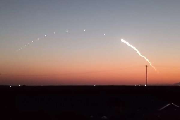 Rare missile tests streak through Tehran twilight
