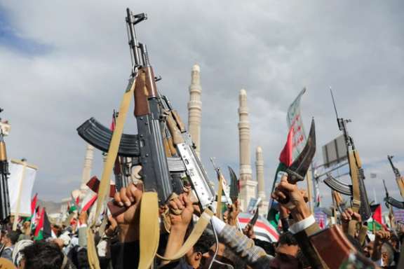 Houthi supporters holding up firearms as they rally to show solidarity with the Palestinians in the Gaza Strip, in Sanaa, Yemen, March 8, 2024
