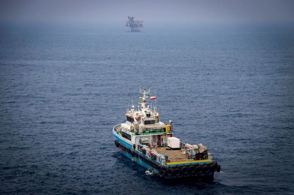 An Iranian vessel moves toward an offshore oil rig in the Persian Gulf, August 2025