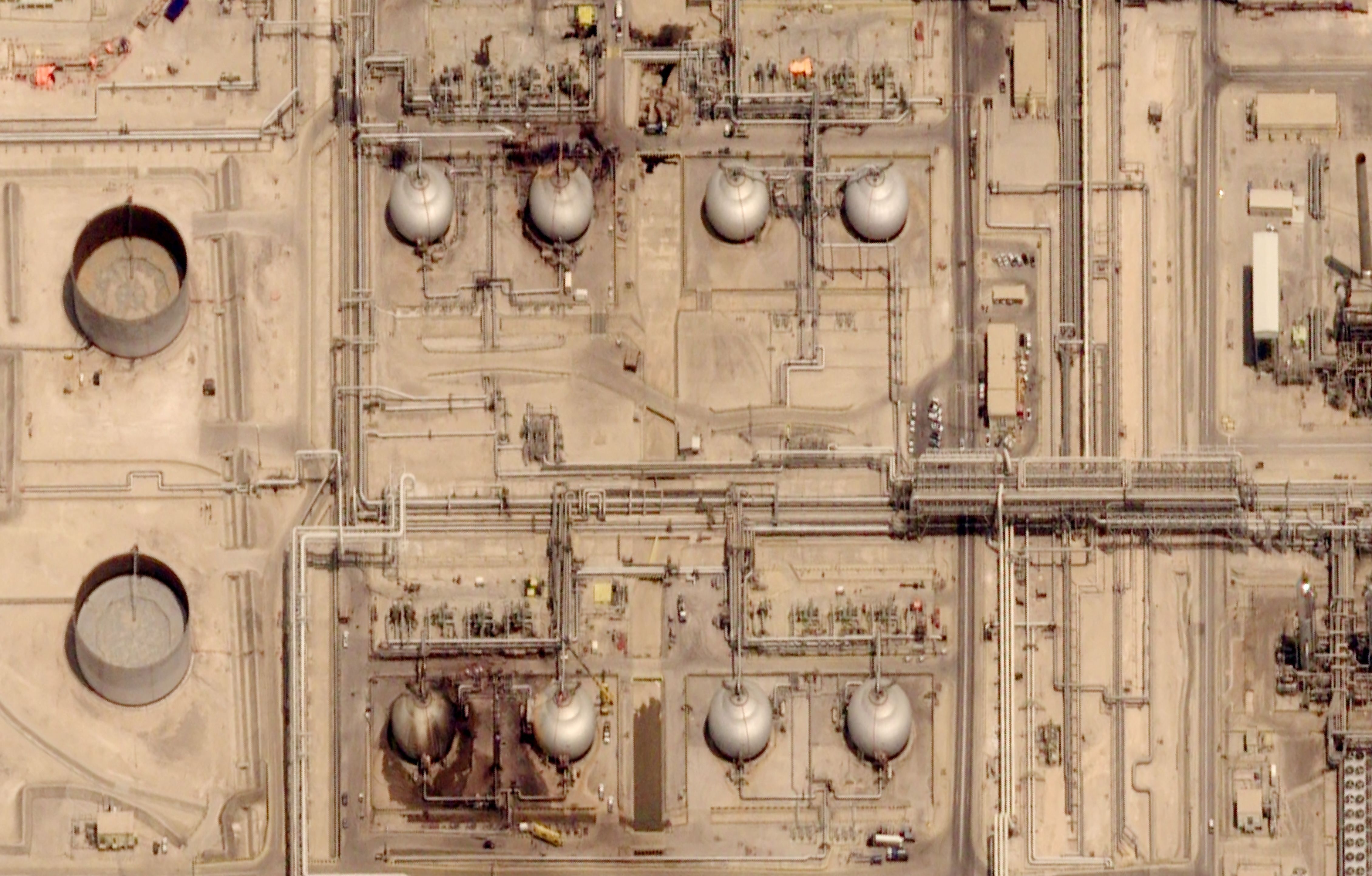A satellite image taken July 30, 2026, shows damage to tanks at Saudi Aramco's Abqaiq oil processing facility, which was attacked on July 27, 2026. 