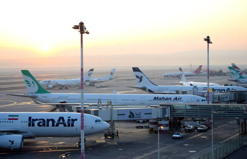US targets Iranian airlines, Iran threatens wider war