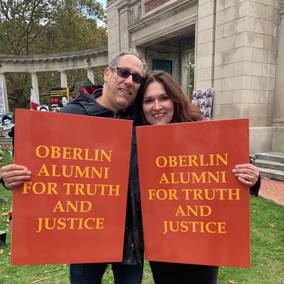 Two protesters at the gates of Oberlin college in November 2021. Photo by Melissa Landa