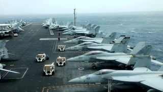 Iranian official rhetoric girds for war as US fleet nears