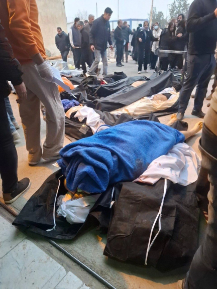 People search for corpses of their loved ones among slain protestors in a Tehran morgue following the January uprising.
