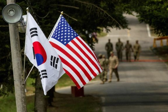 The South Korean and American flags fly next to each other
