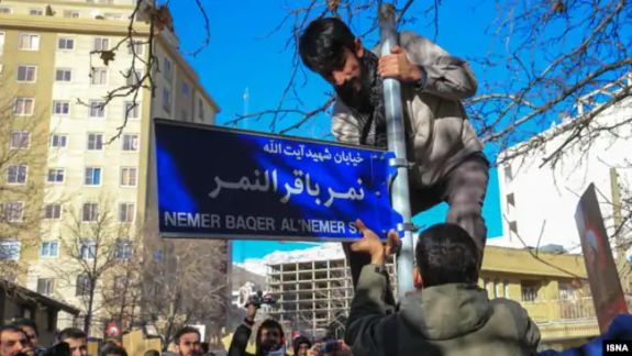 The street sign bearing the name of a Saudi Shiite cleric being installed in Iran, in 2016