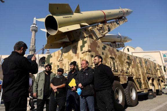 Iranians take photos during an exhibition displaying missiles at Imam Khomeini Grand Mosalla in Tehran January 7, 2022.