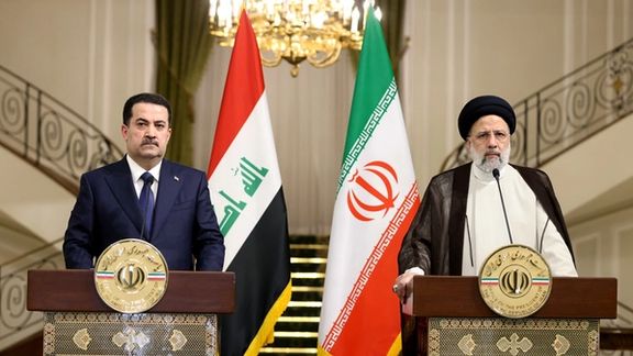 Iraqi Prime Minister Mohammed Shia al-Sudani (left) and Iranian President Ebrahim Raisi speak in a joint press conference in Tehran, on November 29, 2022.