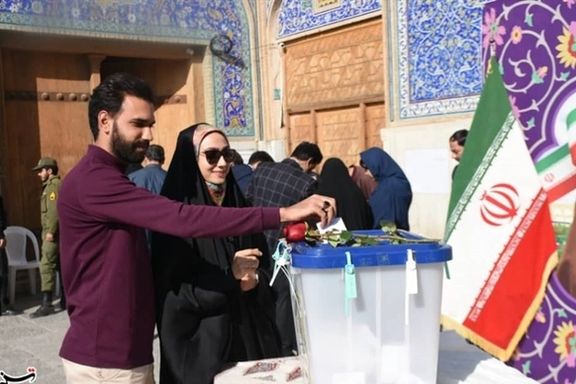 Iranians casting their votes at ballot boxes during the parliamentary elections in the city of Isfahan