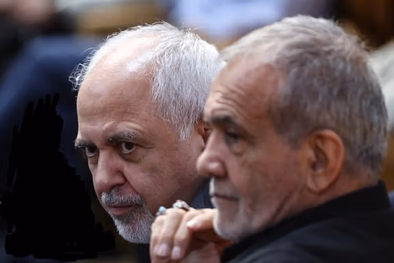 President Masoud Pezeshkian (right) and his deputy Mohammad Javad Zarif
