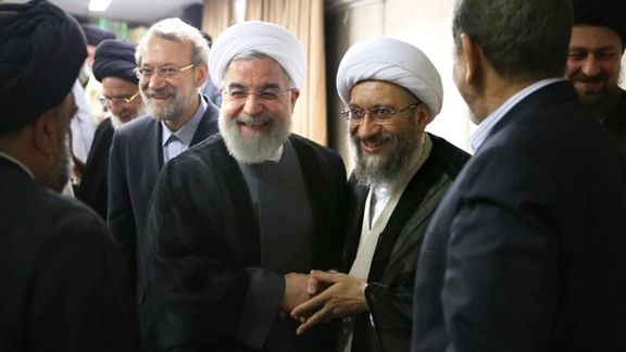 Iran's former president Hassan Rouhani (C) and Ali Larijani (L). Undated. FILE PHOTO