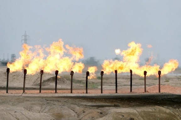 Flames are seen at a station in al-Zubair oilfield, near Basra, Iraq April 21, 2020