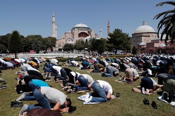 Worshippers attend Friday prayers outside Hagia Sophia Grand Mosque in Istanbul, Turkey August 7, 2020.