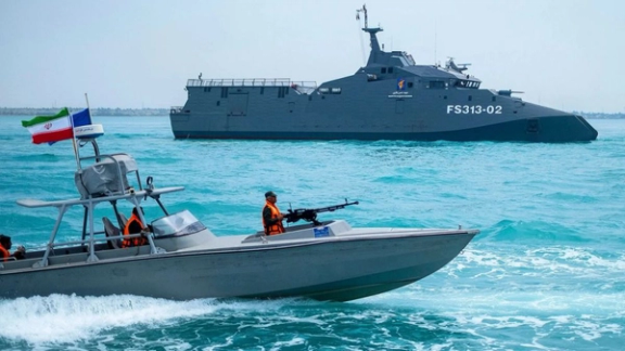 Iranian naval vessels patrol the Persian Gulf during a military exercise