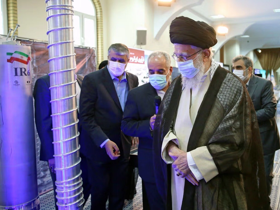 Iran's Supreme Leader Ali Khamenei looking at uranium enrichment centrifuges used by Iran in 2021