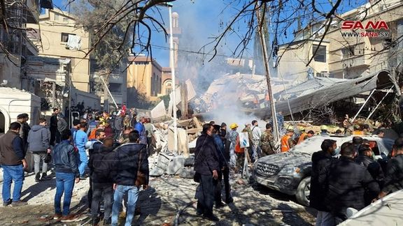 People inspect the damage at the site of a suspected Israeli strike in Damascus, Syria January 20, 2024.