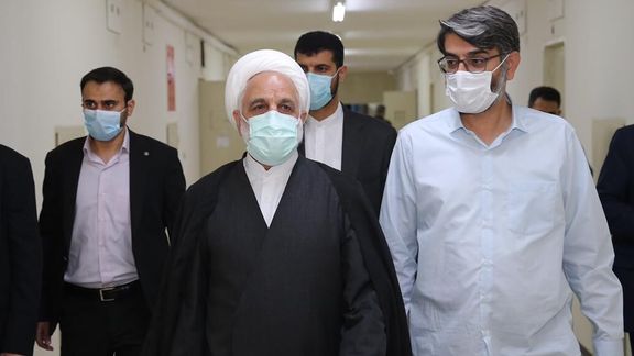 Ejei visiting a prison last year after incriminating prison abuse videos emerged.