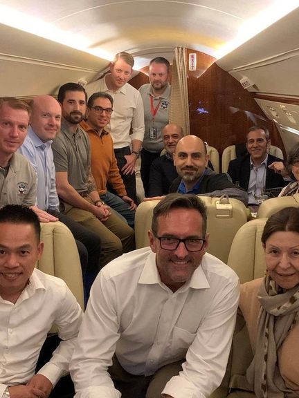 Iranian-Americans released as part of a US prisoner swap deal inside a plane en route to the US