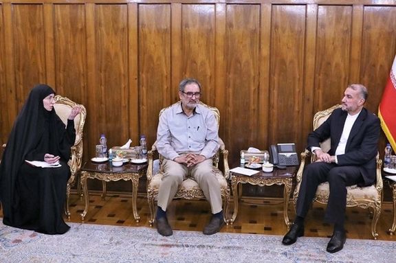 Late Iranian Foreign Minister Hossein Amir-Abdollahian (right) during a meeting with Mohammadreza Nouri’s father and wife in Tehran (undated)