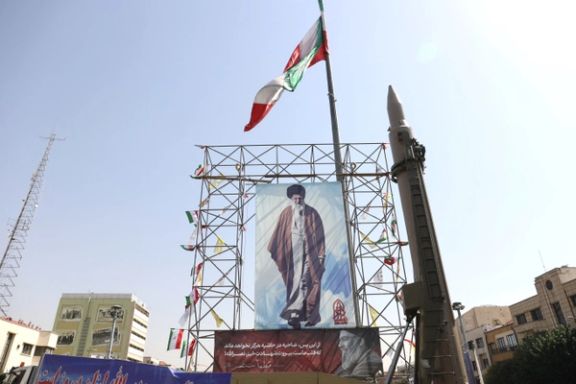 An Iranian missile system is displayed next to a banner with a picture of Iran's Supreme Leader Ayatollah Ali Khamenei and the late Lebanon's Hezbollah leader Hassan Nasrallah, in a street in Tehran, Iran, October 2, 2024.