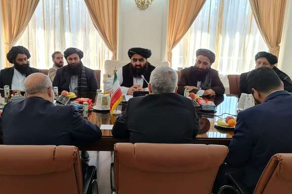 Taliban's acting foreign minister Amir Khan Muttaqi (C) during a meeting with Iranian president's special envoy to Afghanistan Hassan Kazemi Qami on January 9, 2022