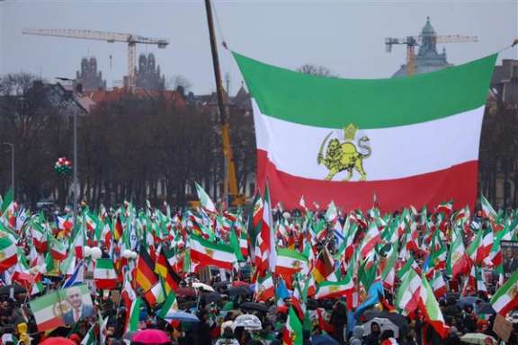 Protesters hold pre-1979 Iranian flags during a rally against Islamic Republic, in Munich, Germany on February 14, 2026.
