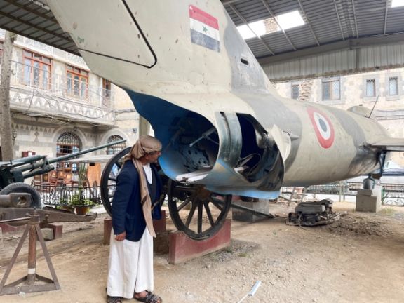 A man looks at a MiG-17 fighter aircraft put on a display at the Military Museum that gives Yemenis a glimpse of the conflicts their country has gone through, in Sanaa, Yemen, March 19, 2023.