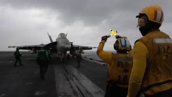 US Navy aircraft prepare to launch from the flight deck of the USS George H.W. Bush in the Arabian Sea as the carrier supports US military operations in the Middle East, in a photo shared by CENTCOM on X.