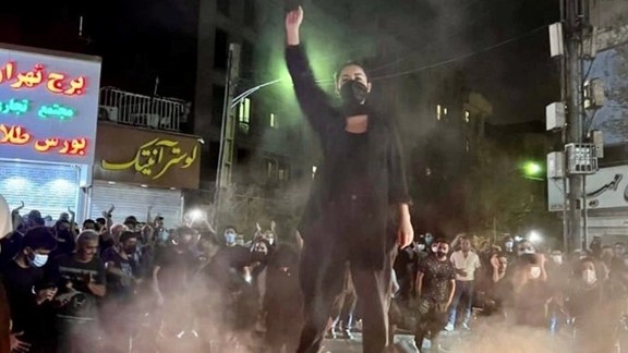 A scene from night time protests in Tehran in September