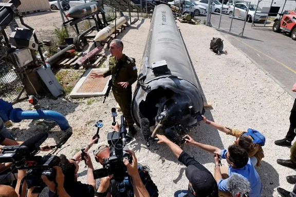 Israeli military spokesperson Rear Admiral Daniel Hagari speaks to the media as Israel's military displays what they say is an Iranian ballistic missile which they retrieved from the Dead Sea after Iran launched drones and missiles towards Israel, at Julis military base, in southern Israel April 16, 2024.